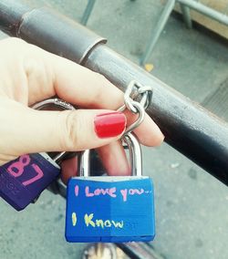 Close-up of woman hand with text