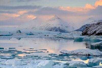 Scenic view of frozen lake against sky during winter