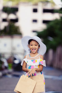 Portrait of cute girl standing outdoors