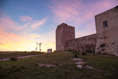 Old ruin building against sky during sunset