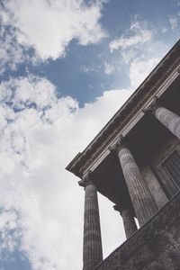 Low angle view of historical building against cloudy sky