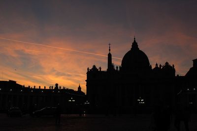 Silhouette temple against sky during sunset