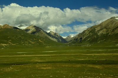 Scenic view of landscape and mountains against sky