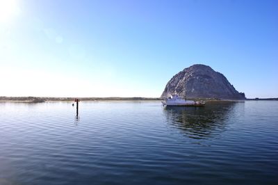 Scenic view of sea against blue sky