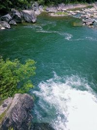 High angle view of rocks in sea