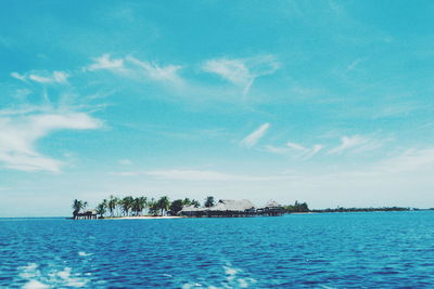 Idyllic view of island against sky