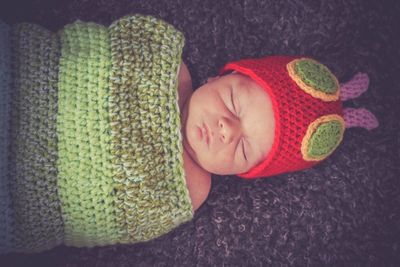 Cute baby boy sleeping in hat