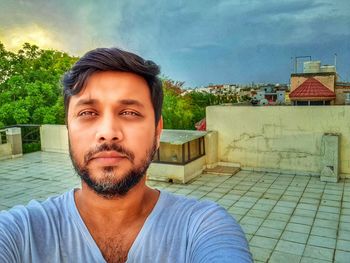 Portrait of man against swimming pool