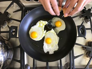 Midsection of person preparing food in kitchen