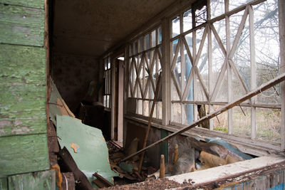 Abandoned building seen through broken window