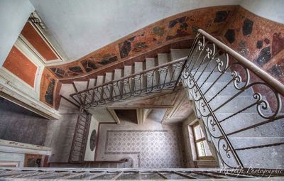 Low angle view of spiral staircase in building