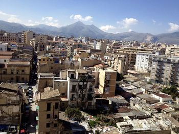 Cityscape against cloudy sky