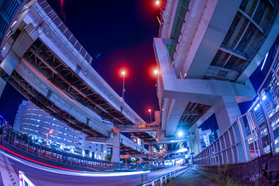 Low angle view of modern buildings in city at night