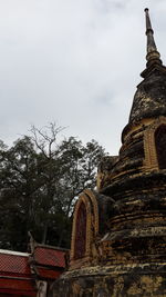 Low angle view of statue against sky