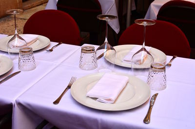 High angle view of glasses on table at restaurant