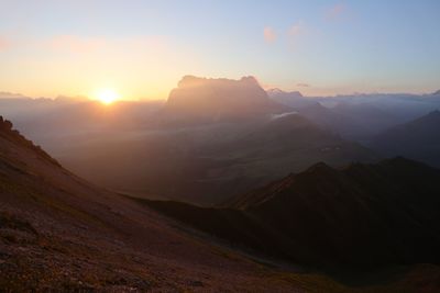 Scenic view of mountains against sky during sunset