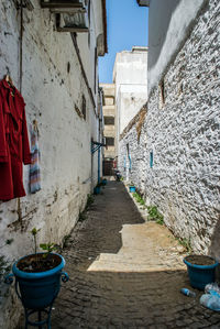 Narrow alley amidst buildings in city