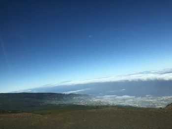 Scenic view of landscape against blue sky