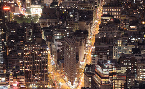 Aerial view of city lit up at night