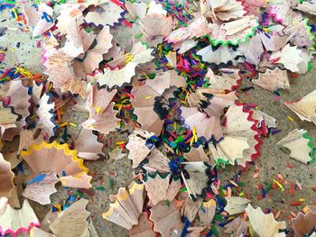 High angle view of multi colored umbrellas on paper