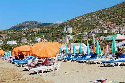 Tent on beach against clear blue sky