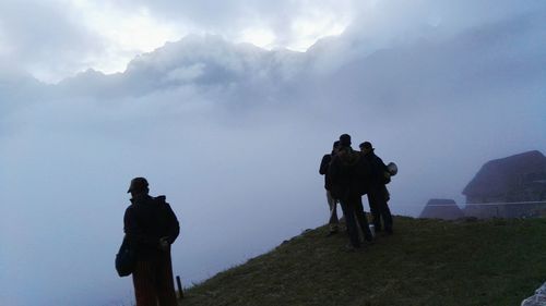 Silhouette of man standing on cliff