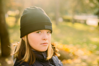 Portrait of young woman wearing hat