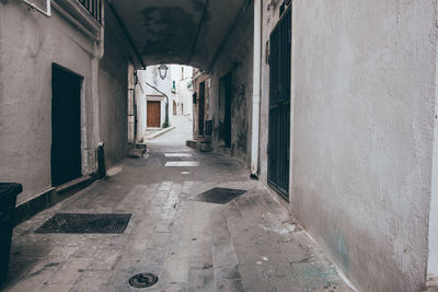 Empty alley amidst buildings