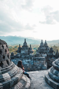 Ancient temple against building