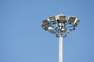 Low angle view of street light against clear blue sky