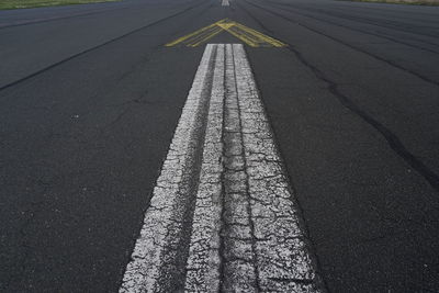 High angle view of arrow sign on road