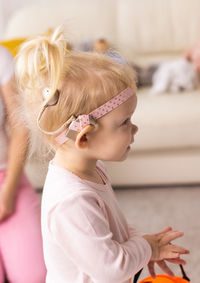 Close-up of girl blowing confetti