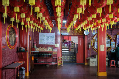 Illuminated lanterns hanging in corridor