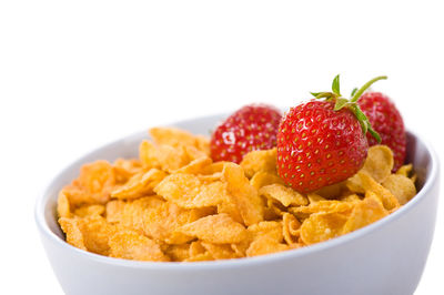 Close-up of fruits in bowl against white background