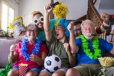 Group of people sitting on soccer field