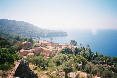 High angle view of townscape by sea against sky in daylight in mallorca, spain. shot on 35mm film