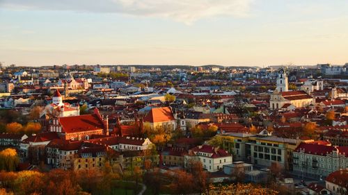 High angle shot of townscape against sky at sunset