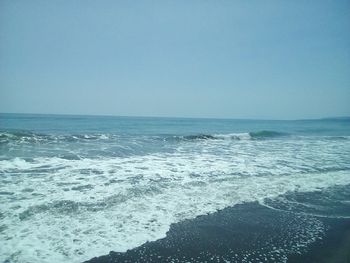 Scenic view of sea against clear blue sky