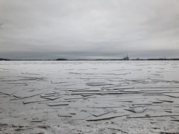 Scenic view of beach against sky