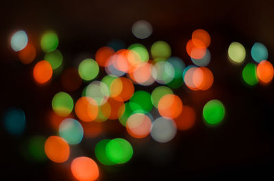 Colored and round lights from bulbs in a blur