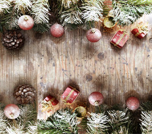 Directly above shot of christmas decorations on wooden table