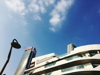 Low angle view of buildings against blue sky