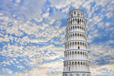 Low angle view of building against cloudy sky