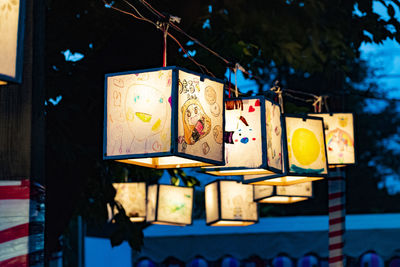 Close-up of illuminated lanterns hanging on tree