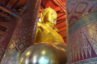 Low angle view of buddha statue at temple