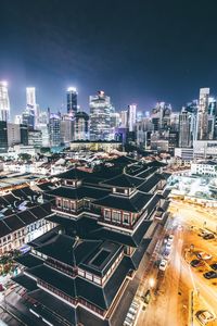 High angle view of illuminated buildings in city at night