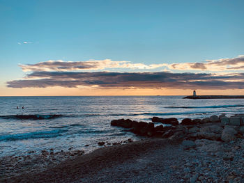 Scenic view of sea against sky during sunset