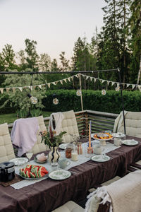Decorated patio with food and drinks arranged on table