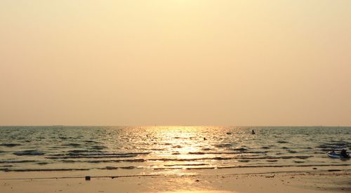 Scenic view of sea against clear sky during sunset