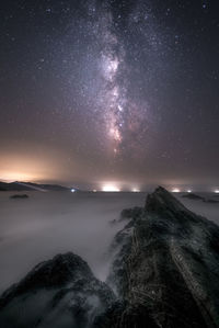 Scenic view of sea against sky at night